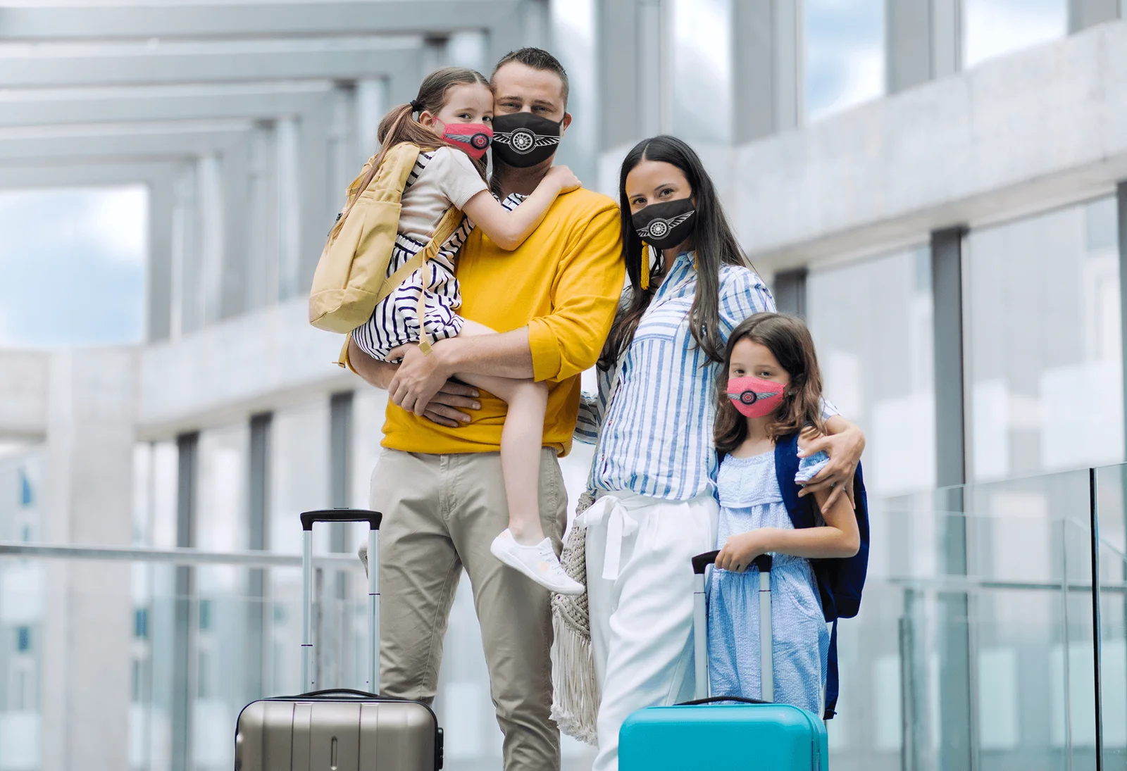 mockup-of-a-family-wearing-face-masks-at-an-airport-39814-r-el2